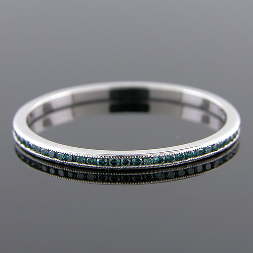 055-180P Ultra thin channel set round treated blue diamond platinum wedding eternity band